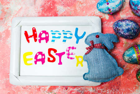 Happy Easter card with creative painted and decorated eggsの写真素材