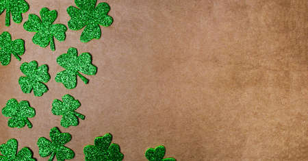 Clover background with copy space on brown backgroundの写真素材