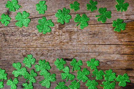 Clovers background with copy space on wooden boardの写真素材