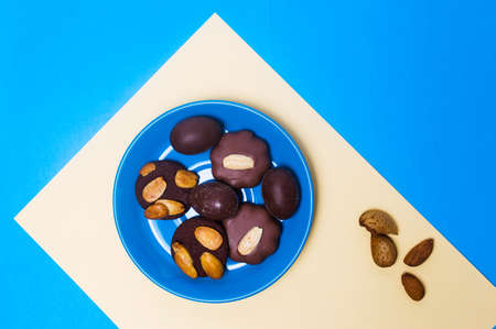 Various chocolate cookies on a plate top view