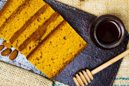 Almond bread slices on a plate top view