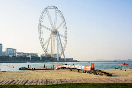 Dubai, United Arab Emirates - March 8, 2018: JBR, Jumeira Beach Resort beach with Ain Dubai ferris wheel emirates future atractionのeditorial素材