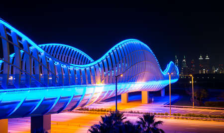 Modern Meydan bridge in Dubai at night