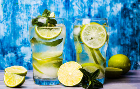 Green lime and mint summer cocktail with iceの写真素材