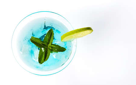 Blue cocktails decorated with lemon on matching backgroundの写真素材