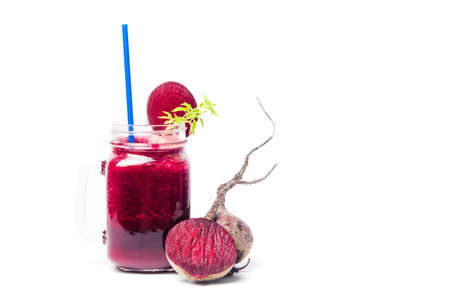 Healthy beet smoothie in a jar isolated on whiteの写真素材