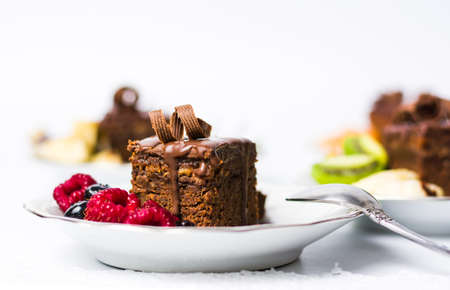 Homemade Chocolate Cake with raspberry fruits on a plate