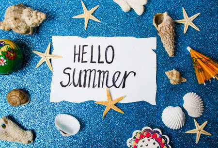 Hello summer card with seaside related objects top viewの写真素材