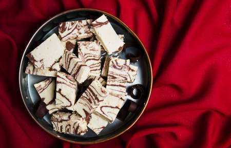 Halva with cacao pieces on a plate top viewの写真素材