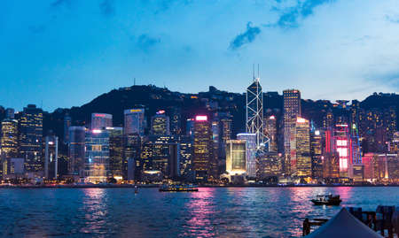 Hong Kong - August 7, 2018: Hong Kong cityscape view of modern downtown buildings over water from...