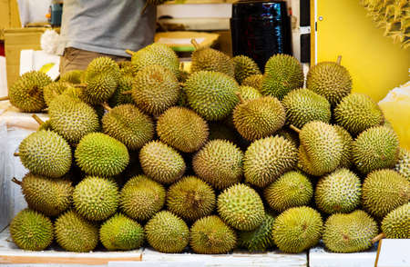 Durian fruit on a pile at the fruits market
