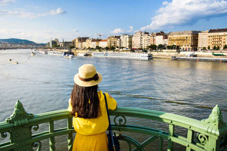 Female traveler enjoying Budapest view from the bridgeの写真素材
