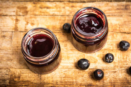 Aronia fruit jam in a jar top viewの写真素材