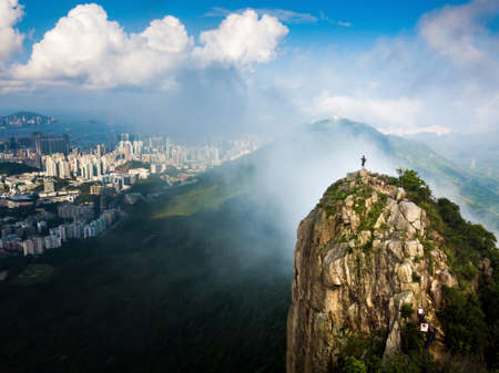 Man enjoying Hong Kong city view from the Lion rock aerial viewのeditorial素材