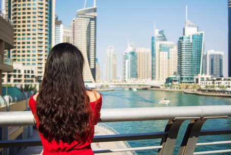Girl enjoying a Dubai marina view in United Arab Emiratesのeditorial素材