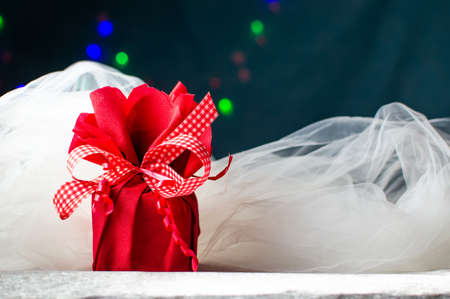 Red Christmas present box against festive backgroundの写真素材