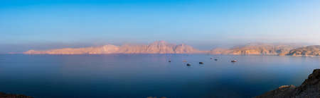 Panorama of idylic sunset over Fjords near Khasab in Omanの写真素材