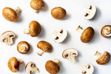 Raw mushrooms on a white background top view