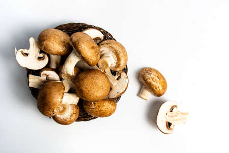 Raw mushrooms on a white background top view