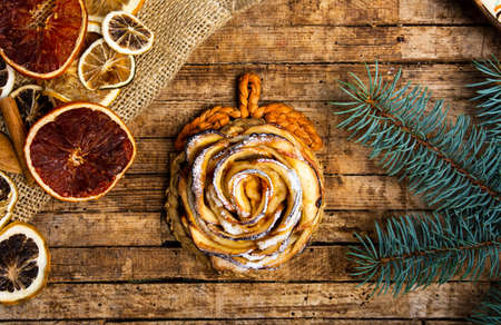 Flower shaped baked apple pie sprinkled with sugarの写真素材