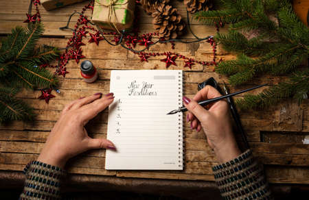 Woman making a list of her new year resolutionsの写真素材