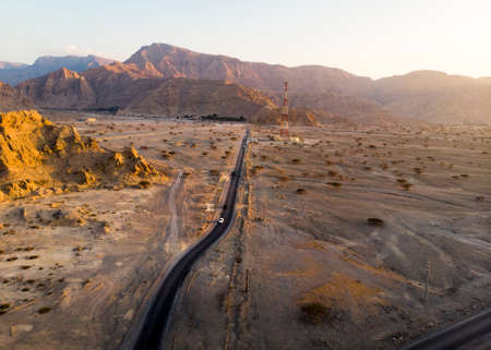 Aerial view of a desert road with rocky sceneryの写真素材