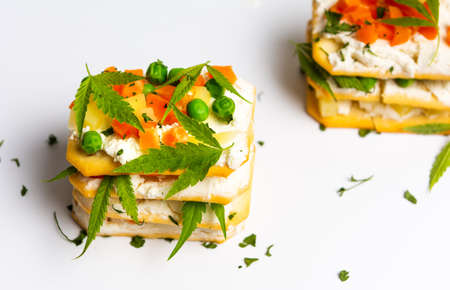 Sandwiches with marijuana leafs and vegetables on whiteの写真素材