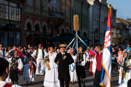 Subotica, Serbia - August 15, 2018: People celebrating harvest season, Duzijance day with a parade in Subotica main squareのeditorial素材