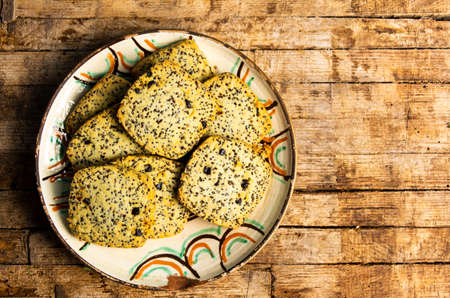 Integral cookies with chia seeds on a wooden tableの写真素材