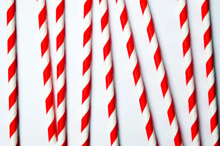 Red and white straws on white background top viewの写真素材