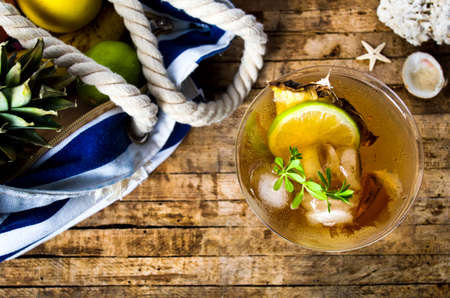 Pineapple cocktail on a wooden table top viewの写真素材