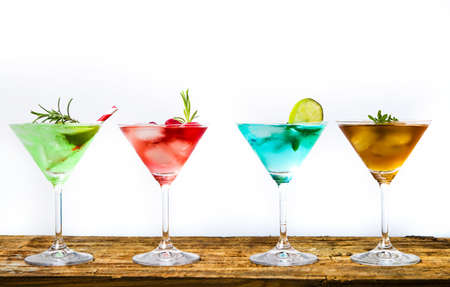 Colorful summer cocktails on a table isolatedの写真素材