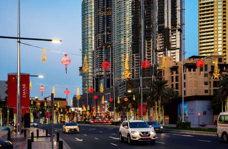 Dubai, United Arab Emirates - January 31, 2018: Downtown Dubai streets decorated and illuminated for Chinese lunar New Year with cars passing byのeditorial素材