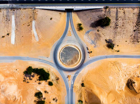 Roundabout and road in the desert aerial viewの写真素材