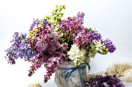 Colorful lilac spring flowers bouquet in a vaseの写真素材