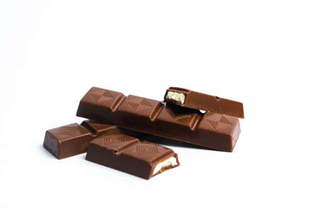 Chocolate piece isolated on white background top view