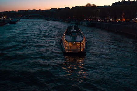 Tourist boat on the river Seine in Paris Franceの写真素材