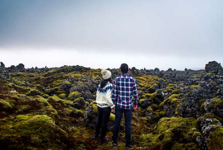 Couple enjoying lava field scenery in Iceland