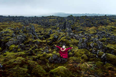 Woman enjoying lava field scenery in Iceland