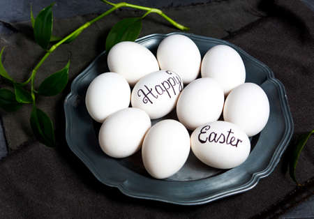 Happy Easter note written on eggs for religious holidayの写真素材