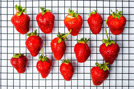 Strawberry fruit on a kitchen net top viewの写真素材