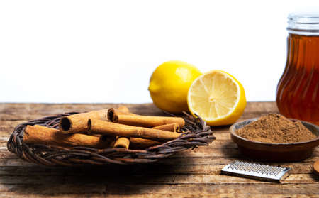 Cinnamon with dried lemon on a wooden table