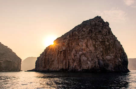 Sunset at fjords of Musandam peninsula near Khasab in Omanの写真素材