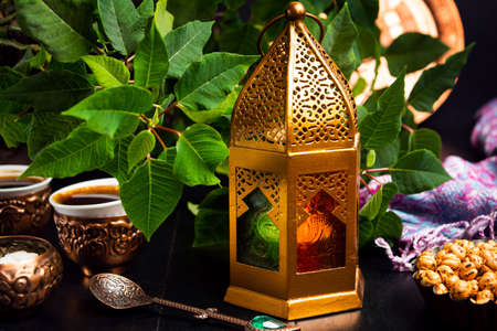 Dates served with coffee in Arabic style arrangement on a table
