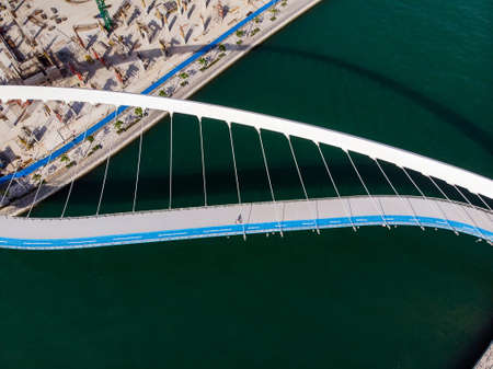 Dubai water canal tolerance bridge over the creek aerial viewの写真素材