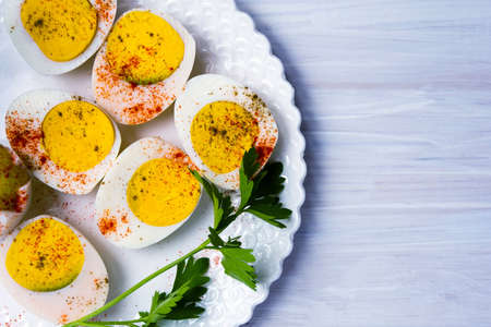 Sliced boiled eggs on a plate top viewの写真素材