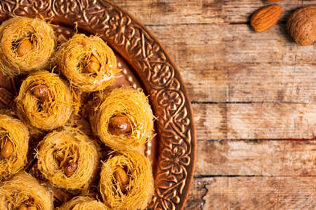Arabic kadayif baklava dessert with cashew nuts on a plateの写真素材