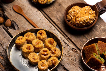 Arabic desserts in rustic bowls top view