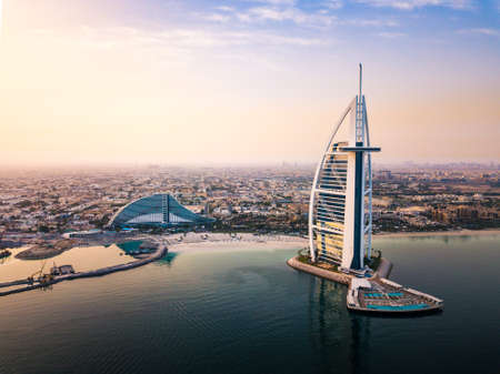 Dubai seaside skyline and Burj Al Arab luxury hotel aerial view at sunriseのeditorial素材