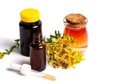 Calendula Pot marigold herbal essential oil and flowers isolated on whiteの写真素材